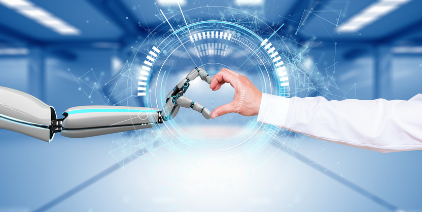 Roboterhand und menschliche Hand formen ein Herzsymbol - Künstliche Intelligenz in Dating Apps