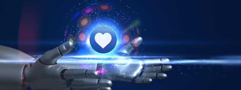 Künstliche Intelligenz in Dating Apps: Die Zukunft der Partnersuche Roboterhand hält ein leuchtendes Herzsymbol - Künstliche Intelligenz in Dating Apps
